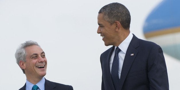 US President Barack Obama walks alongside Chicago Mayor Rahm Emanuel (L) upon Obama's arrival on Air Force One at Chicago O'Hare International Airport in Chicago, Illinois, May 29, 2013. Obama is traveling to attend Democratic fundraisers. AFP PHOTO / Saul LOEB (Photo credit should read SAUL LOEB/AFP/Getty Images)