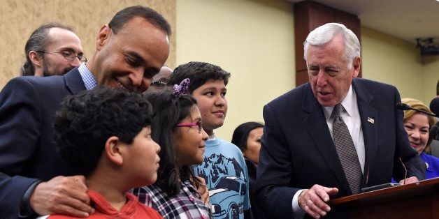 House Minority Whip Steny Hoyer of Md., right, talks to Adolofo Martinez, 13, center, Miranda Martinez, 8, and Emilio Martinez, 7, as Rep. Luis V. Gutierrez, D-Ill., listens, before the start of a news conference on Capitol Hill in Washington, Wednesday, Jan. 14, 2015, on the House Republican's immigration policies. Republicans in the House of Representatives voted Wednesday to overturn President Barack Obamaâs immigration policies and remove protections for immigrants brought illegally to America as kids. (AP Photo/Susan Walsh)