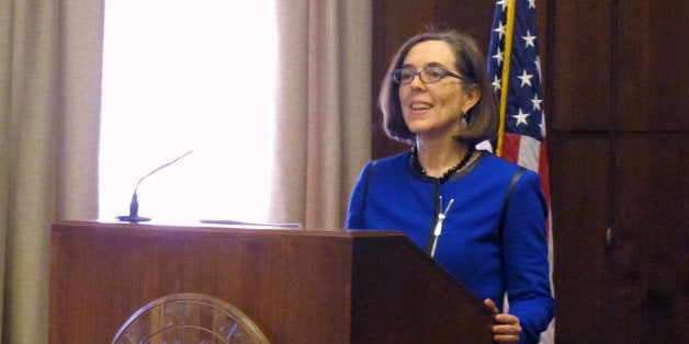 Oregon Gov. Kate Brown speaks to reporters at the state Capitol in Salem, Oregon on Friday, Feb. 20, 2015. In her first press