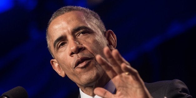 US President Barack Obama addresses the General Session of the 2015 Democratic National Committee (DNC) Winter Meeting in Washington, DC, on February 20, 2015. AFP PHOTO/NICHOLAS KAMM (Photo credit should read NICHOLAS KAMM/AFP/Getty Images)