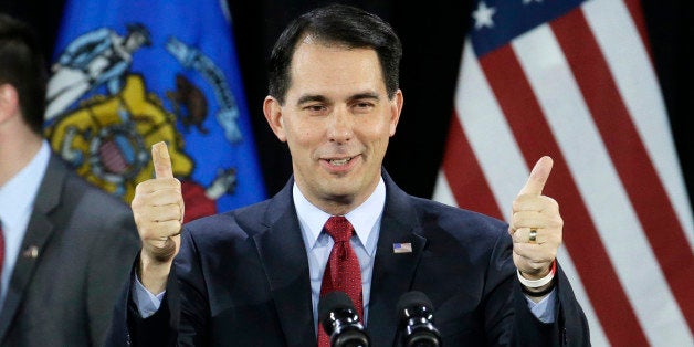 FILE - In a Tuesday, Nov. 4, 2014 file photo, Wisconsin Republican Gov. Scott Walker gives a thumbs up as he speaks at his campaign party, in West Allis, Wis. Less than two years ago, party leaders solemnly declared after an exhaustive study that the GOP "must embrace and champion comprehensive immigration reform." It was critical for the party's survival, they said, to address an issue that was paramount to the nation's surging Hispanic population. But as President Obama issued a sweeping immigration order last week, some of the Republican Party's most prominent governors â likely presidential candidates among them â described immigration reform as little more than an afterthought. (AP Photo/Morry Gash, File)