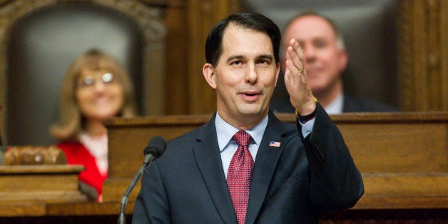 Wisconsin Gov. Scott Walker acknowledges people in the gallery during Governor's State of the State address to a joint session of the Legislature in the Assembly chambers at the state Capitol, Tuesday, Jan. 13, 2015, in Madison, Wis. (AP Photo/Andy Manis)