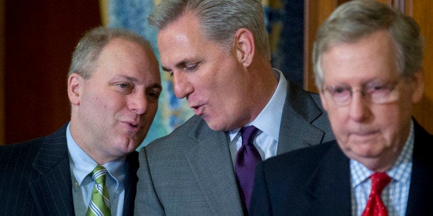 House Majority Leader Kevin McCarthy, a Republican from California, center, talks to House Majority Whip Steve Scalise, a Republican from Louisiana, during an enrollment ceremony to sign the Keystone XL Pipeline Approval Act (S.1) with Senate Majority Leader Mitch McConnell, a Republican from Kentucky, right, at the U.S. Capitol in Washington, D.C., U.S., on Friday, Feb. 13, 2015. Congressional Republicans achieved an elusive legislative goal Wednesday, sending a bill to approve the Keystone XL pipeline to President Barack Obama. The U.S. House passed the measure 270-152, with 29 Democrats joining all but one Republican to support the bill. Photographer: Andrew Harrer/Bloomberg via Getty Images
