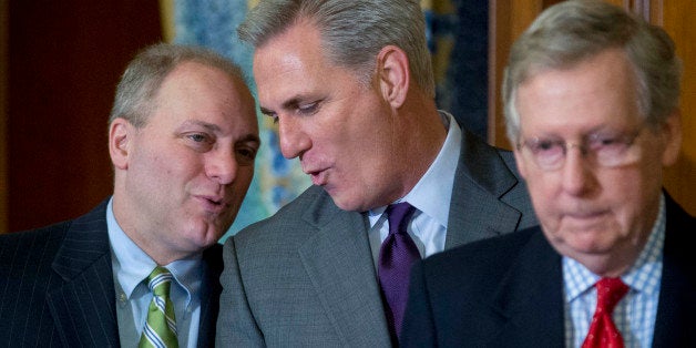 House Majority Leader Kevin McCarthy, a Republican from California, center, talks to House Majority Whip Steve Scalise, a Republican from Louisiana, during an enrollment ceremony to sign the Keystone XL Pipeline Approval Act (S.1) with Senate Majority Leader Mitch McConnell, a Republican from Kentucky, right, at the U.S. Capitol in Washington, D.C., U.S., on Friday, Feb. 13, 2015. Congressional Republicans achieved an elusive legislative goal Wednesday, sending a bill to approve the Keystone XL pipeline to President Barack Obama. The U.S. House passed the measure 270-152, with 29 Democrats joining all but one Republican to support the bill. Photographer: Andrew Harrer/Bloomberg via Getty Images 