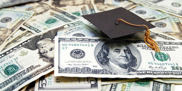 mini graduation cap on US money -- education costs