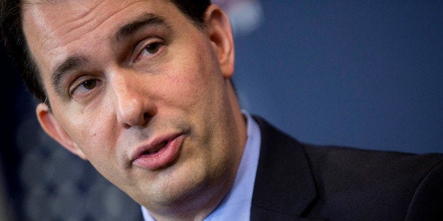 Scott Walker, governor of Wisconsin, speaks during a panel discussion at the American Action Forum in Washington, D.C., U.S., on Friday, Jan. 30, 2015. This week Walker announced the formation of a new committee to explore his presidential option dubbed 'Our American Revival,' and is the latest clue as to whether Walker would seek his party's nomination. Photographer: Andrew Harrer/Bloomberg via Getty Images 