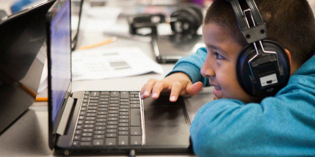 SAN JOSE, CA - FEBRUARY 18: A students works on a computer in the lab at Rocketship SI Se Puede, a charter, public elementary school, on February 18, 2014 in San Jose, California. Students here are taught using blended learning which utilizes technology and online learning mixed with traditional, face-to-face instruction to give students more individualized teaching. Students can learn at their own pace. Teachers are freed up to help students who are behind as well as allow high achievers to go faster. (Photo by Melanie Stetson Freeman/The Christian Science Monitor via Getty Images)