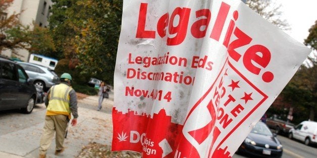 A 'legalize' poster for a referendum about legalizing marijuana is placed in Washington, DC on October 31, 2014. Ballot Initiative 71 would legalize the cultivation and possession of limited amounts of marijuana in the District of Columbia. AFP PHOTO/YURI GRIPAS (Photo credit should read YURI GRIPAS/AFP/Getty Images)