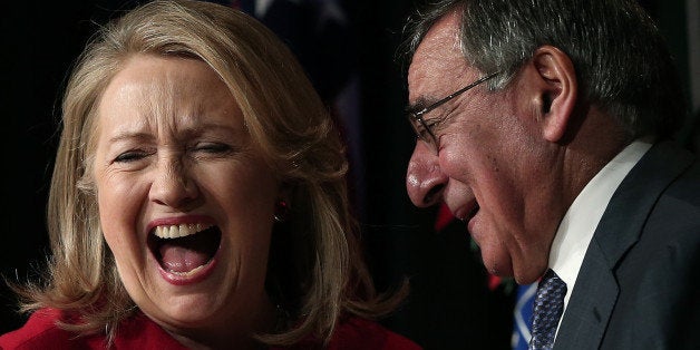 ARLINGTON, VA - FEBRUARY 14: Former U.S. Secretary of State Hillary Clinton jokes with U.S. Secretary of Defense Leon Panett