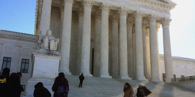 WASHINGTON, DC - FEBRUARY 24: (EDITORS NOTE: Image was created using an iPhone.) People line up outside the United States Supreme Court before going inside the hear oral arguments in the case Henderson v United States February 24, 2015 in Washington, DC. The Supreme Court heard arguments in the case of Tony Henderson, a former U.S. Border Patrol agent who was convicted of drug offences and subsequently sought to either transfer or sell his 19 guns to his wife. He is challenging lower court orders to block the sale or transfer. (Photo by Chip Somodevilla/Getty Images)