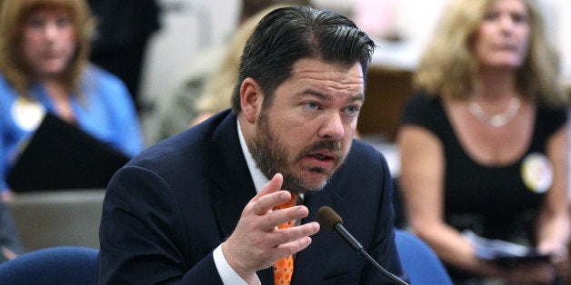 Nevada Senate Minority Leader Michael Roberson, R-Las Vegas, testifies in committee at the Legislative Building in Carson City, Nev., on Friday, April 5, 2013. Builders and homeowners squared off Friday over Nevada's construction defect laws as Roberson presented a bill he says will limit frivolous lawsuits. (AP Photo/Cathleen Allison)