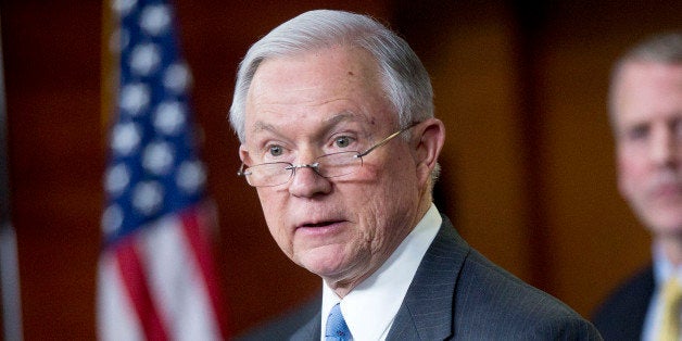 Senator Jeff Sessions, a Republican from Alabama, speaks during a news conference on the Department of Homeland Security (DHS) funding bill with Senator Dan Sullivan, a Republican from Arkansas, right, in Washington, D.C., U.S., on Thursday, Feb. 12, 2015. The DHS is operating under a continuing resolution that expires on Feb 27 with a stalemate over whether the must-pass measure should carry riders to upend President Barack Obama's immigration policies continuing to threaten passage of the legislation. Photographer: Andrew Harrer/Bloomberg via Getty Images 