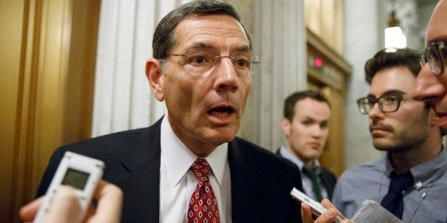 Sen. John Barrasso, R-Wyo., Republican Policy Committee chairman, speaks to reporters as he leaves the Senate chamber after a roll call vote, at the Capitol in Washington, Wednesday, Nov. 12, 2014. Congress returns to work for the lame duck session today following a sweep for the GOP in the midterm elections that will shift the balance of power in January, giving Republicans control of the Senate with Sen. Mitch McConnell, R-Ky., taking over as majority leader. (AP Photo/J. Scott Applewhite)