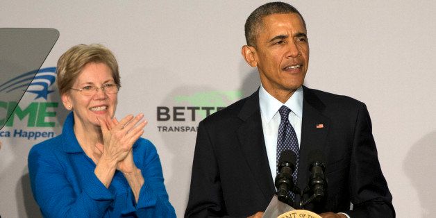 Sen. Elizabeth Warren, D-Mass. applauds as President Barack Obama arrives to speak at AARP in Washington, Monday, Feb. 23, 2015. President Barack Obama says too few Americans approaching retirement have saved enough to have peace of mind during their later years. (AP Photo/Jacquelyn Martin)