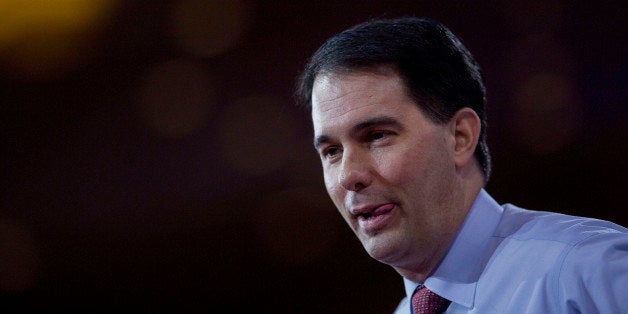 Scott Walker, governor of Wisconsin, pauses while speaking during the Conservative Political Action Conference (CPAC) in National Harbor, Maryland, U.S., on Thursday, Feb. 26, 2015. The 42nd annual CPAC, which runs until Feb. 28, features most of the potential Republican candidates for president, from Ben Carson and Carly Fiorina to Jeb Bush and Scott Walker. Photographer: Andrew Harrer/Bloomberg via Getty Images 