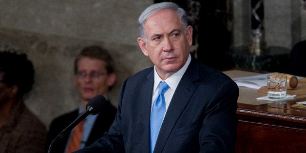 Benjamin Netanyahu, Israel's prime minister, pauses while speaking during a joint meeting of Congress in the House Chamber at