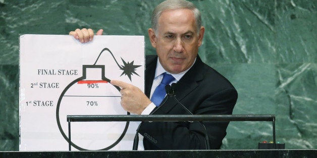 NEW YORK, NY - SEPTEMBER 27: Benjamin Netanyahu, Prime Minister of Israel, points to a red line he drew on a graphic of a bomb while addressing the United Nations General Assembly on September 27, 2012 in New York City. The 67th annual event gathers more than 100 heads of state and government for high level meetings on nuclear safety, regional conflicts, health and nutrition and environment issues. (Photo by Mario Tama/Getty Images)