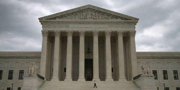 WASHINGTON, DC - AUGUST 20: Guards stand in front of the Supreme Court Building, August 20, 2014 in Washington, DC. Today the high court blocked gay and lesbian couples from marrying in Virginia and puts on hold a federal appeals court's verdict last month striking down the state's ban on gay marriage. (Photo by Mark Wilson/Getty Images)