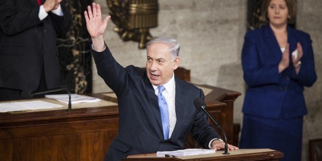 WASHINGTON, USA - MARCH 3: Israeli Prime Minister Benjamin Netanyahu speaks to assembled members of the United States Congress in the U.S. Capitol in Washington, USA on March 3, 2015. The arrangement for Prime Minister Netanyahu to address the Congress has raised some objections because it bypassed President Obama and the State Department who are responsible for all diplomatic exchanges with foreign heads of state and diplomats. It is expected that some 40 members of Congress have declined to attend the speech out of protest. (Photo by Samuel Corum/Anadolu Agency/Getty Images)