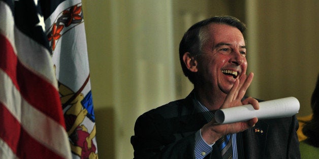 SPRINGFIELD, VA - NOV 07: With his concession speech in hand, Ed Gillespie waved at supporters as he entered the meeting room