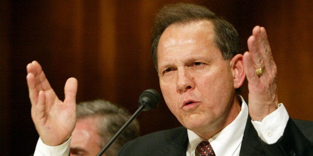 WASHINGTON - JUNE 8: Roy Moore, former Chief Justice of The Alabama Supreme Court, testifies at a Senate Constitution, Civil Rights and Property Rights Subcommittee hearing, entitled 'Beyond the Pledge of Allegiance: Hostility to Religious Expression in the Public Square.' on Capitol Hill in Washington, DC June 8, 2004. Moore was removed from office for refusing to take down a public display of the Ten Commandments in the courthouse. (Photo by Matthew Cavanaugh/Getty Images)