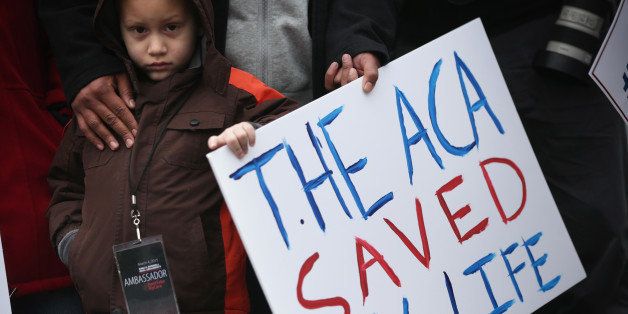 WASHINGTON, DC - MARCH 04: Five-year-old James Cook of Cleveland, Ohio, participates in a rally to support the Affordable Care Act in front of the U.S Supreme Court March 4, 2015 in Washington, DC. The Supreme Court was scheduled to hear oral arguments in the case of King v. Burwell that could determine the fate of health care subsidies for as many as eight million people. (Photo by Alex Wong/Getty Images)