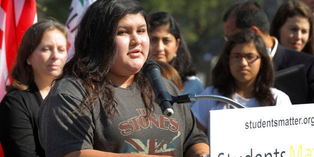 Raylene Monterroza takes questions from the media, as she is joined by eight other California public school students who are suing the state to abolish its laws on teacher tenure, seniority and other protections, during a news conference outside the Los Angeles Superior Court Monday, Jan. 27, 2014 in Los Angeles. Their case Vergara v. California is the latest battle in a growing nationwide challenge to union-backed protections for teachers. (AP Photo/Nick Ut)