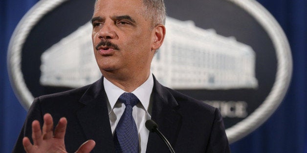 WASHINGTON, DC - MARCH 04: Attorney General Eric Holder delivers remarks about the Justice Department's findings related to two investigations in Ferguson, Missouri, at the Robert F. Kennedy Department of Justice Building March 4, 2015 in Washington, DC. Holder delivered the remarks for an audience of department employees who worked on the investigations after a white police officer shot and killed an unarmed black teenager, sparking weeks of demonstrations and violent clashes. (Photo by Chip Somodevilla/Getty Images)