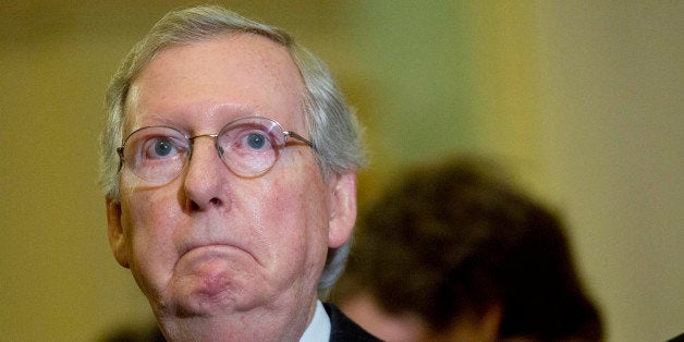 Senate Majority Leader Mitch McConnell, a Republican from Kentucky, listens during a news conference following a Senate luncheon at the U.S. Capitol in Washington, D.C., U.S., on Tuesday, Feb. 24, 2015. Days before funding for the Department of Homeland Security expires, McConnell is getting a mixed reaction to his plan to separate agency financing from opposition to President Barack Obama's immigration policies. Photographer: Andrew Harrer/Bloomberg via Getty Images 