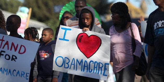 LOS ANGELES, CA - JANUARY 20: Supporters of the Affordable Care Act (ACA) march in the 29th annual Kingdom Day Parade on January 20, 2014 in Los Angeles, California. The Kingdom Day Parade honors the memory of African-American civil rights leader Martin Luther King Jr. and coincides with Martin Luther King Day. (Photo by David McNew/Getty Images)