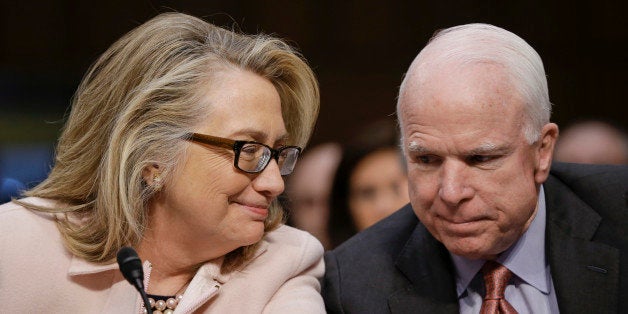 Secretary of State Hillary Rodham Clinton huddles with Sen. John McCain, R-Ariz., on Capitol Hill in Washington, Thursday, Jan. 24, 2013, as they prepare to introduce Senate Foreign Relations Chairman Sen. John Kerry, D-Mass., at his confirmation hearing before the committee to become secretary of state, replacing Clinton. (AP Photo/J. Scott Applewhite)