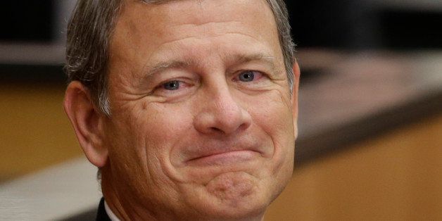U.S. Supreme Court Chief Justice John Roberts smiles as he is introduced at the University of Nebraska Lincoln, in Lincoln, Neb., Friday, Sept. 19, 2014. Chief Justice Roberts said heâs worried about growing partisanship in the judicial confirmation process and a public perception that the court is a political body. (AP Photo/Nati Harnik)