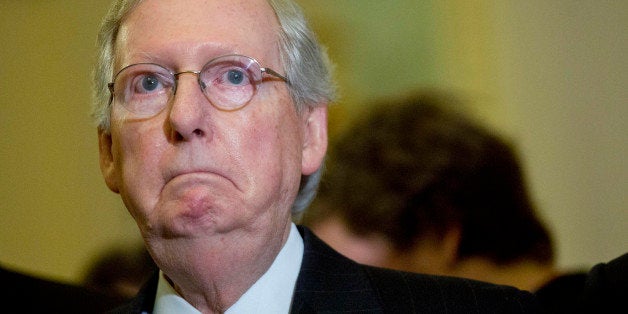 Senate Majority Leader Mitch McConnell, a Republican from Kentucky, listens during a news conference following a Senate luncheon at the U.S. Capitol in Washington, D.C., U.S., on Tuesday, Feb. 24, 2015. Days before funding for the Department of Homeland Security expires, McConnell is getting a mixed reaction to his plan to separate agency financing from opposition to President Barack Obama's immigration policies. Photographer: Andrew Harrer/Bloomberg via Getty Images 