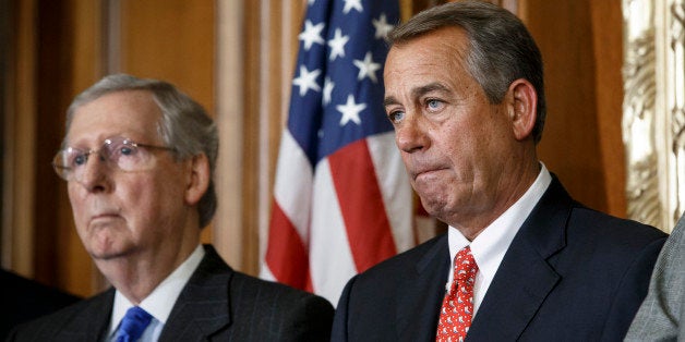 Speaker of the House John Boehner, R-Ohio, joined by Senate Majority Leader Mitch McConnell, R-Ky., left, leads a ceremony for the Clay Hunt Suicide Prevention for American Veterans Act, at the Capitol in Washington, Tuesday, Feb. 10, 2015. The bill is named for Clay Hunt, a Marine Corps combat veteran who died by suicide in March 2011 at the age of 28. The legislation, which now goes to President Obama for his signature, calls for evaluation of existing Veterans Affairs mental health and suicide prevention programs, and expands the reach of these programs for veterans. (AP Photo/J. Scott Applewhite)