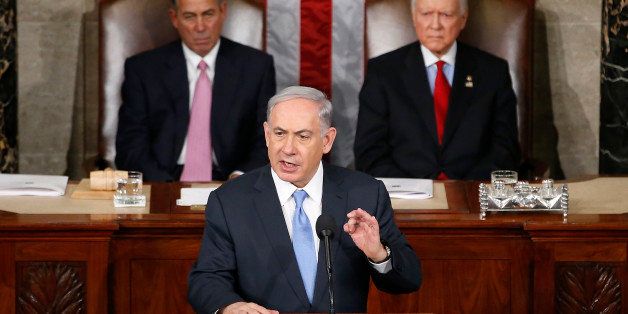 Israeli Prime Minister Benjamin Netanyahu speaks before a joint meeting of Congress on Capitol Hill in Washington, Tuesday, March 3, 2015. Netanyahu said the world must unite to `stop Iran's march of conquest, subjugation and terror'. House Speaker John Boehner of Ohio, left, and Sen. Orrin Hatch, R-Utah listen. (AP Photo/Andrew Harnik)