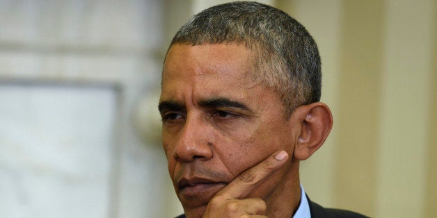 President Barack Obama listens during his meeting with European Council President Donald Tusk, Monday, March 9, 2015, in the Oval Office of the White House in Washington. (AP Photo/Susan Walsh)