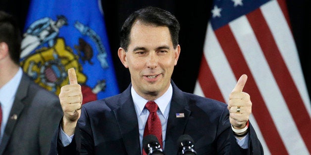 FILE - In a Tuesday, Nov. 4, 2014 file photo, Wisconsin Republican Gov. Scott Walker gives a thumbs up as he speaks at his ca