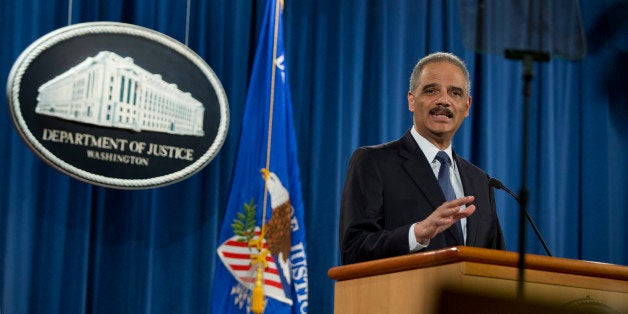 Attorney General Eric Holder speaks at the Justice Department in Washington, Wednesday, March 4, 2015, about the Justice Departmentâs findings related to two investigations in Ferguson, Mo. The Justice Department will not prosecute a white former police officer in the fatal shooting of an unarmed black 18-year-old whose death in Ferguson sparked weeks of protests and ignited an intense national debate over how police treat African-Americans. But the government released a scathing report Wednesday that faulted the city for racial bias. (AP Photo/Carolyn Kaster)