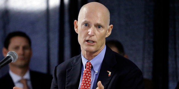 FILE - In this Feb. 5, 2015 file photo, Florida Gov. Rick Scott gestures during a cabinet meeting at the Florida State Fair, in Tampa, Fla. Scott, who has repeatedly tangled with public record advocates, media organizations and others over whether he has followed the stateâs transparency law, has insisted did not use private email accounts for state business. (AP Photo/Chris O'Meara, file)