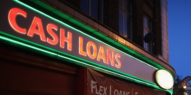 LONDON, ENGLAND - NOVEMBER 01: A general view of a 'Speedy Cash' cash loans shop on Brixton High Street on November 1, 2012 in London, England. The recession has changed the face of the UK's high streets, which have seen a boom in bookmakers, discount stores, charity shops, cheque cashing (payday loans) and pawnbrokers as cash-strapped Brits struggled with their finances. (Photo by Dan Kitwood/Getty Images)