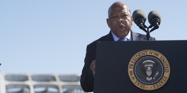 US Representative John Lewis, Democrat of Georgia and one of the original marchers, speaks during an event marking the 50th Anniversary of the Selma to Montgomery civil rights marches at the Edmund Pettus Bridgein Selma, Alabama, on March 7, 2015. US President Barack Obama rallied a new generation of Americans to the spirit of the civil rights struggle, warning their march for freedom 'is not yet finished.' In a forceful speech in Selma, Alabama on the 50th anniversary of the brutal repression of a peaceful protest, America's first black president denounced new attempts to restrict voting rights. AFP PHOTO/ SAUL LOEB (Photo credit should read SAUL LOEB/AFP/Getty Images)