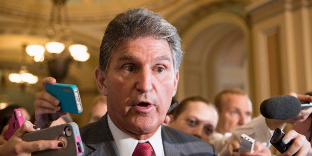 Sen. Joe Manchin, D-W.Va., talks to reporters on Capitol Hill in Washington, Tuesday, Sept. 10, 2013. as he leaves a closed-door meeting on Syria with President Barack Obama. (AP Photo/J. Scott Applewhite)