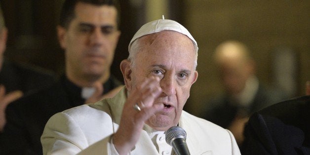 Pope Francis makes the sign of the cross at the end of a pastoral visit to the Roman Parish of 'Santa Maria Madre del Redentore a Tor Bella Monaca' on March 8, 2015 in Rome. AFP PHOTO / ANDREAS SOLARO (Photo credit should read ANDREAS SOLARO/AFP/Getty Images)