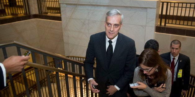 Denis McDonough, White House chief of staff, center, walks up a stairwell while speaking to members of the media at the Capitol Visitors Center after attending a House Democratic caucus meeting at the U.S. Capitol in Washington, D.C., U.S., on Thursday, Dec. 11, 2014. The House passed a $1.1 trillion spending bill after a day of disarray and just hours before U.S. government funding runs out. Photographer: Andrew Harrer/Bloomberg via Getty Images 