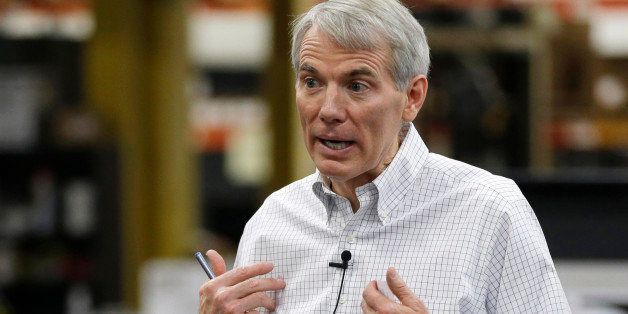 Sen. Rob Portman, R-Ohio, conducts a town hall meeting with employees after a tour of Harris Products Group, Friday, Oct. 3, 2014, in Mason, Ohio. Portman says he will wait until after the midterm elections to decide whether to mount a presidential run or to focus on winning a second Senate term in 2016. (AP Photo/Al Behrman)