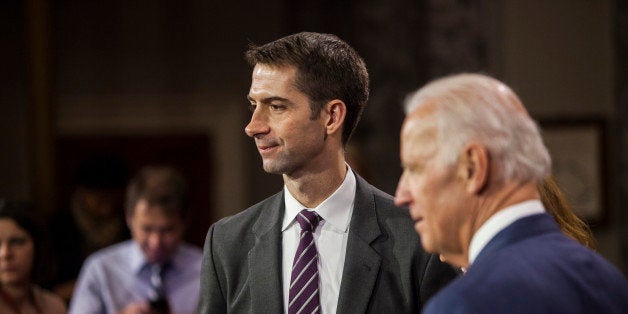 WASHINGTON, D.C. - JANUARY 6: Senator Tom Cotton (R-AK) reenacts his swearing in to the 114th U.S. Congress with Vice President Joe Biden in Washington, D.C. on January 6, 2015. (Photo by Samuel Corum/Anadolu Agency/Getty Images)