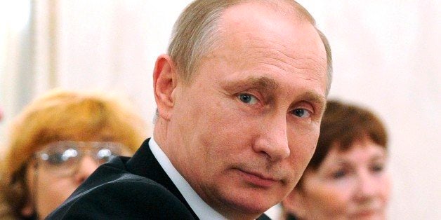 Russian President Vladimir Putin attends an International Women's Day celebration in the Kremlin, in Moscow, Russia, Sunday,
