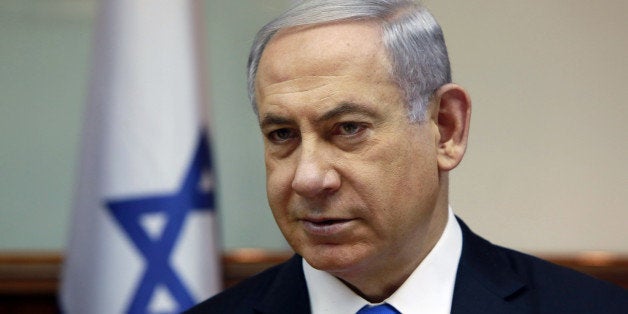 Israeli Prime Minister Benjamin Netanyahu chairs the weekly cabinet meeting at his Jerusalem office, Sunday, March 8, 2015. Tens of thousands of Israelis gathered Saturday night at a Tel Aviv square under the banner "Israel wants change" and called for Netanyahu to be replaced in March 17 national elections. (AP Photo/Gali Tibbon, Pool)