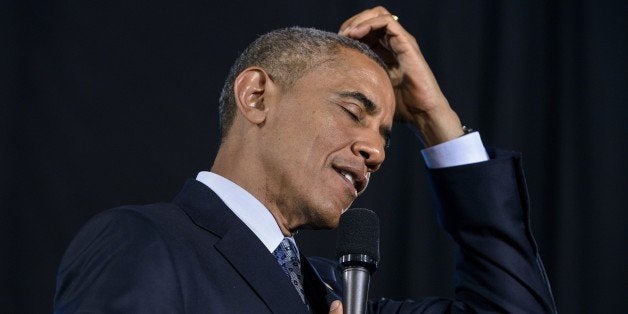 US President Barack Obama thinks while answering an audience questionsat the City Club of Cleveland March 18, 2015 in Clevela