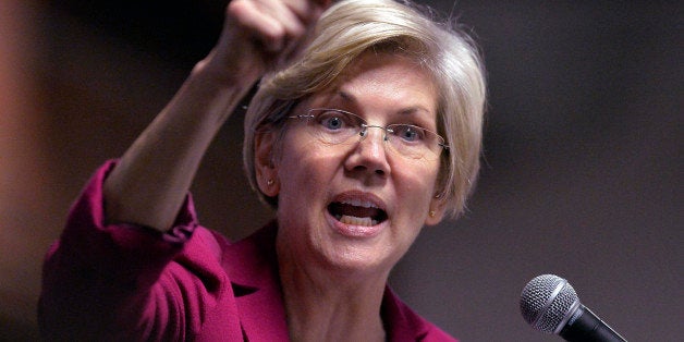 Massachusetts Senator Elizabeth Warren speaks to a rally of supporters of Kentucky senatorial candidate Alison Lundergan Grimes at the Copper & Kings Distillery in Louisville, Ky., Tuesday, Oct. 28, 2014. (AP Photo/Timothy D. Easley)